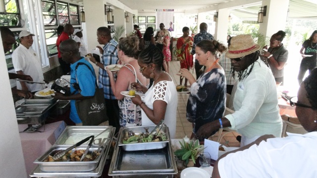 Guests enjoying samples offered by restaurants participating in the St. Kitts and Nevis Restaurant Week Tasting Showcase at the Mount Nevis Hotel on July 15, 2016